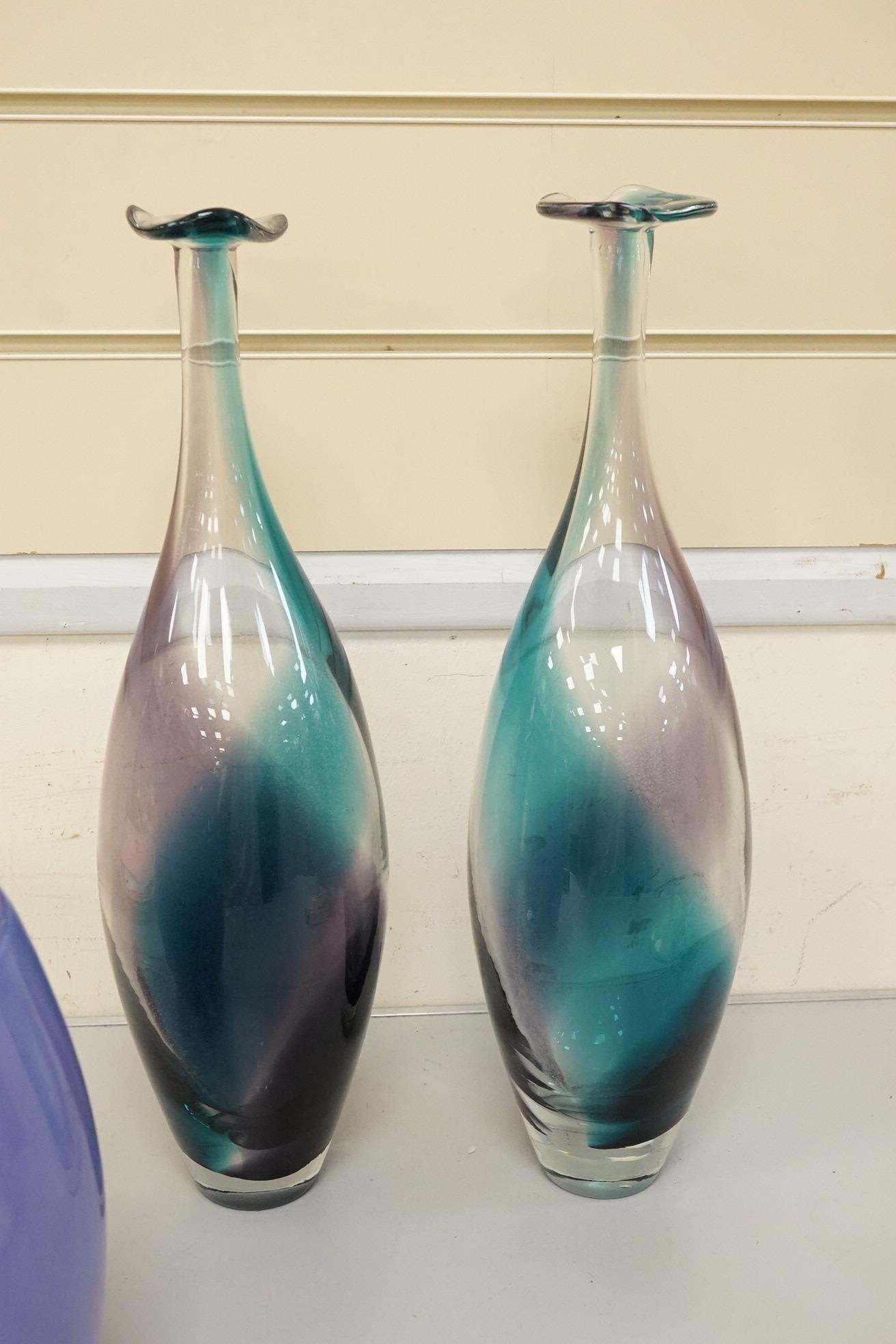 Three art glass vases to include a pair of purple and blue stem vases, 42cm high